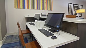 A hotel workspace with multiple computer stations, a printer, and a desk lamp. - Holiday Inn Express Hotel & Suites Phoenix North Scottsdale by IHG (Phoenix)