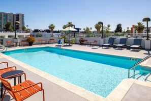 Outdoor pool, open 9:00 AM to 10:00 PM, pool umbrellas, pool loungers