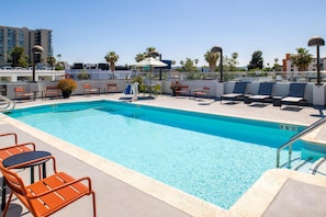 Outdoor pool, open 9:00 AM to 10:00 PM, pool umbrellas, pool loungers