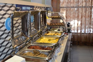 A buffet with various food options including scrambled eggs, bacon, and pastries. - Holiday Inn Express Hotel & Suites Selinsgrove by IHG (Selinsgrove)