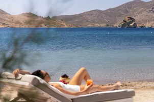 On the beach, sun loungers, beach umbrellas, beach towels
