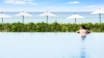 Outdoor pool, pool umbrellas, sun loungers