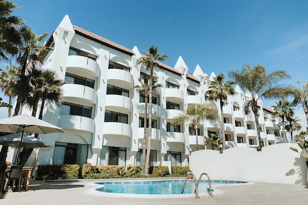 Outdoor pool, open 10:00 AM to 10:00 PM, free cabanas, pool umbrellas