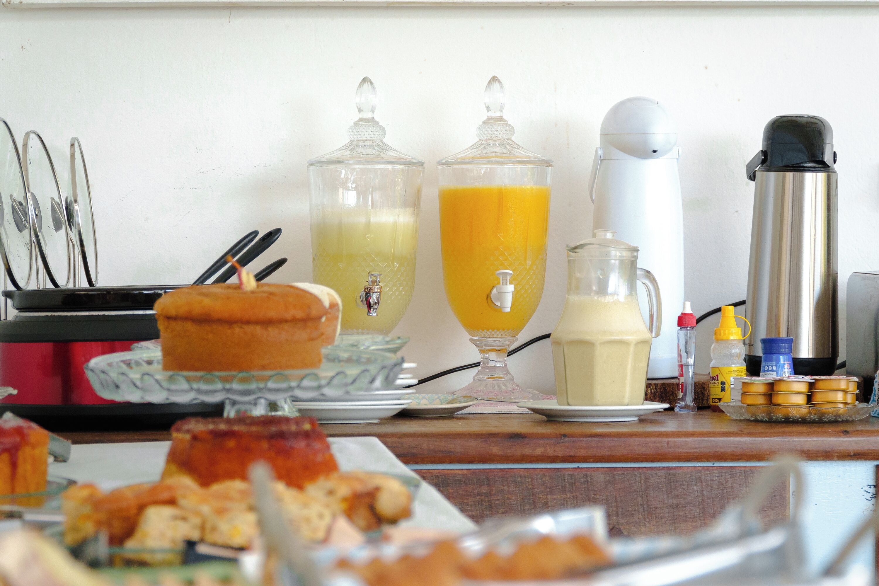 A breakfast buffet with various food items and beverages.