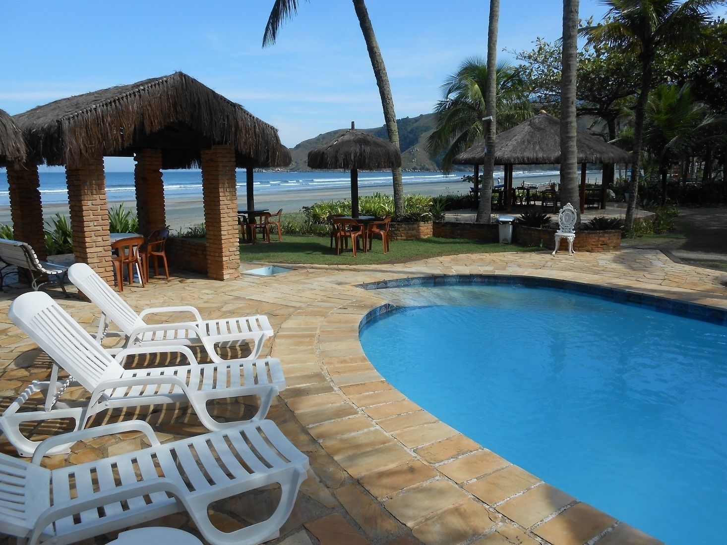 outdoor pool, open 10 am to 10 pm, pool umbrellas, pool loungers