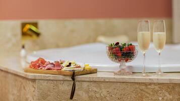 Enjoy a gourmet selection of meats, cheeses, and fresh fruits in this stylish room.