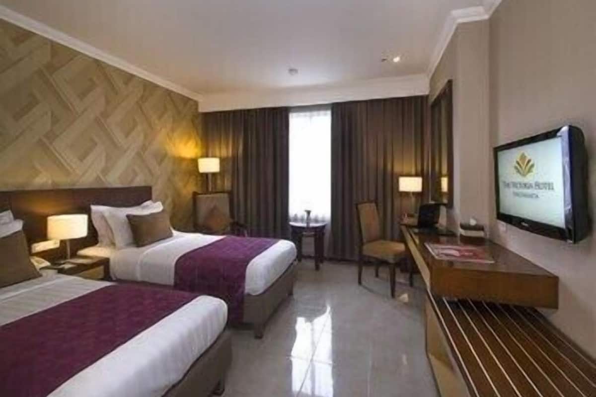 Een minibar, een kluis op de kamer, gratis wifi, beddengoed