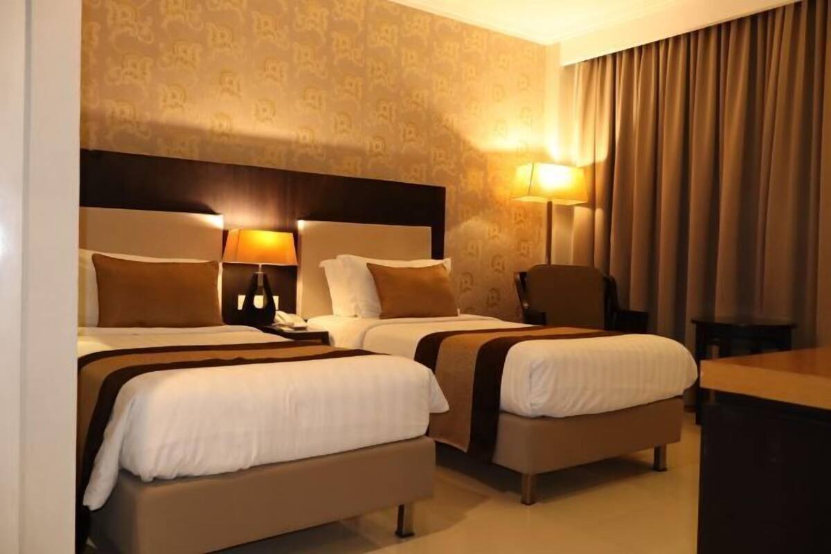 Een minibar, een kluis op de kamer, gratis wifi, beddengoed