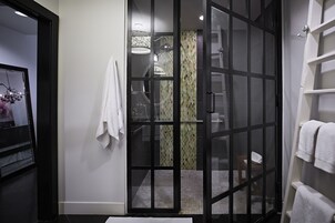 Designer toiletries, hair dryer, bathrobes, slippers