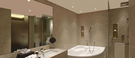 Un baño moderno con un espejo grande, una bañera, una ducha y un tocador con lavamanos y toallero.