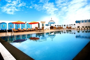 Outdoor pool, open 7:00 AM to 7:00 PM, pool umbrellas, pool loungers