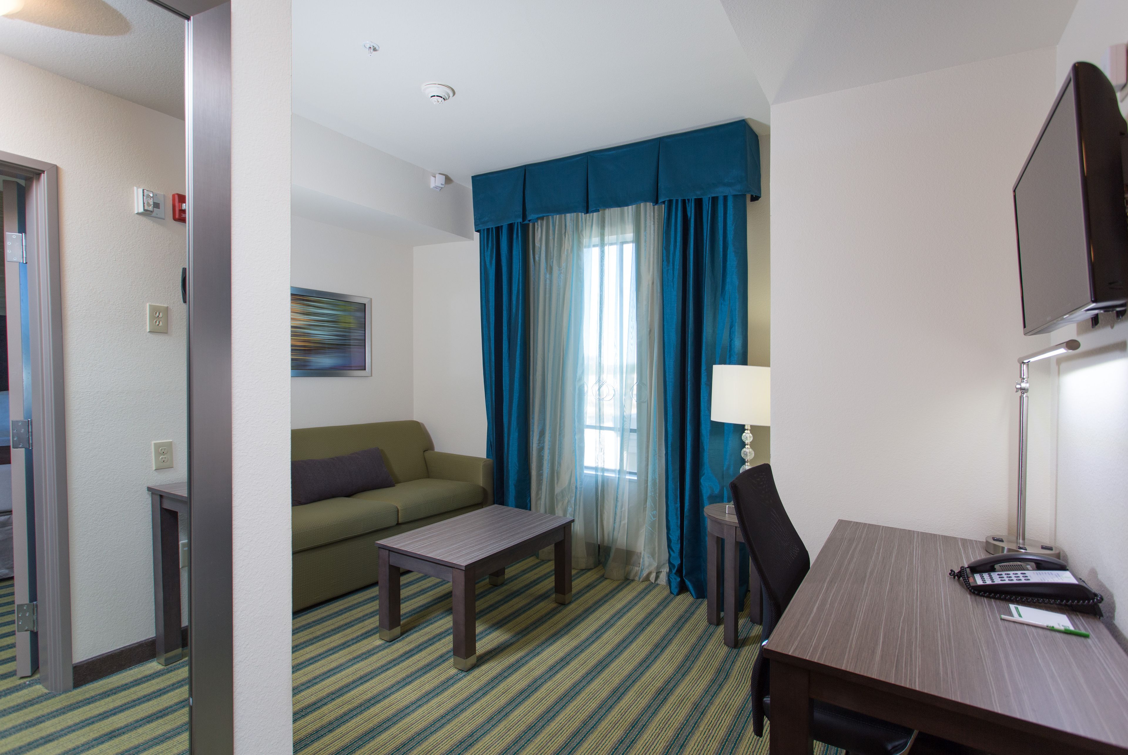 premium bedding, desk, laptop workspace, blackout curtains