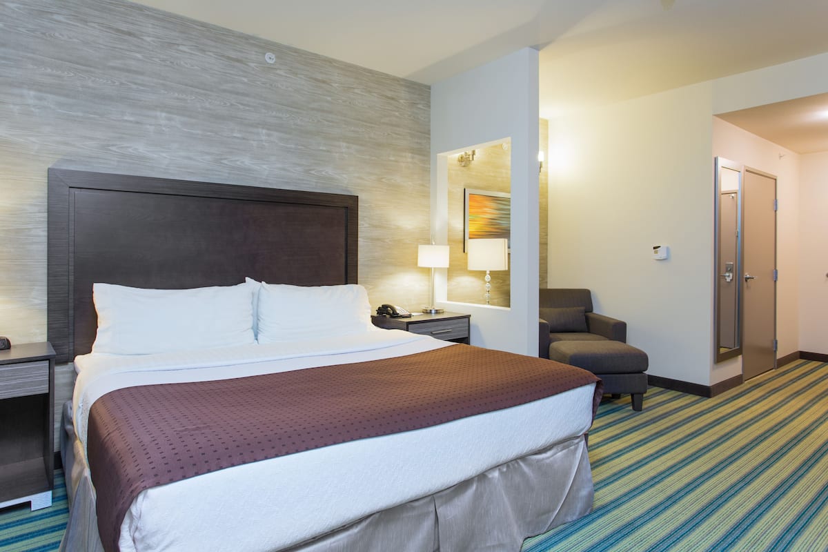 Premium bedding, desk, laptop workspace, blackout drapes