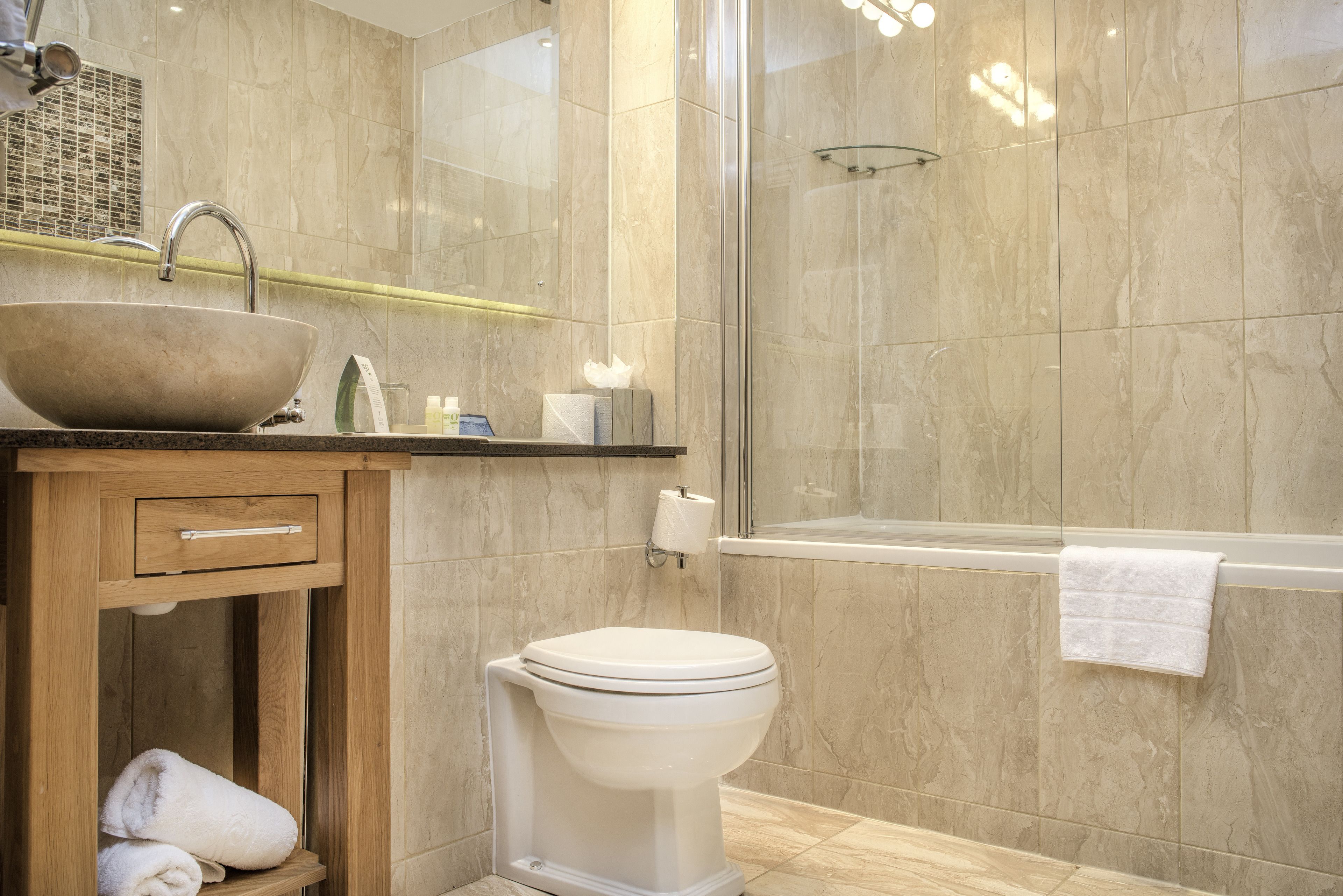 Designer toiletries, hair dryer, towels, soap
