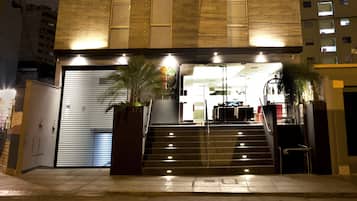 Stunning building with a unique facade, featuring horizontal panels and a welcoming entrance.