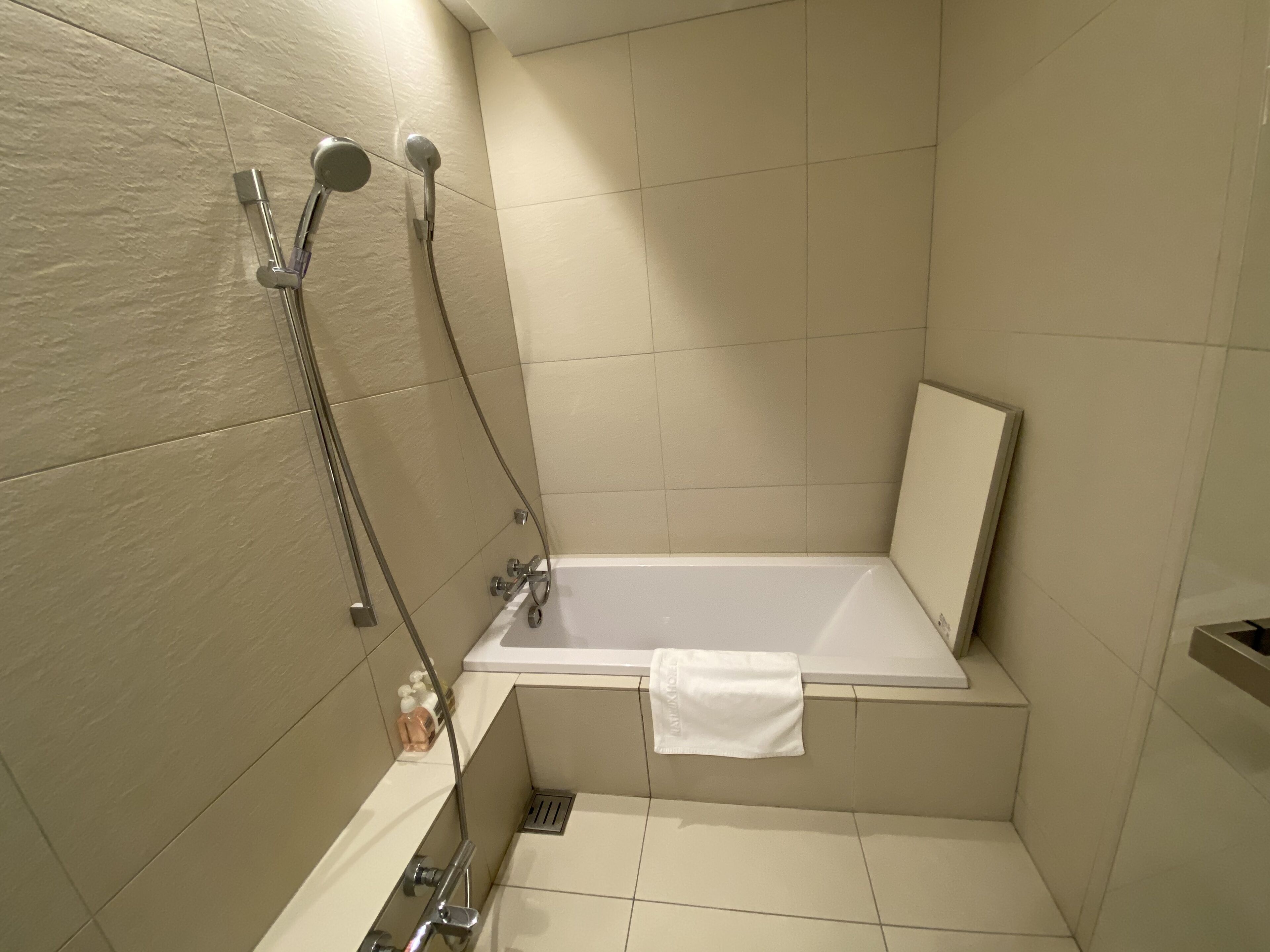 A bathroom with a bathtub, a shower, and a toilet.