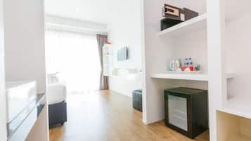 Deluxe Room, Pool View | Minibar, in-room safe, desk, free WiFi
