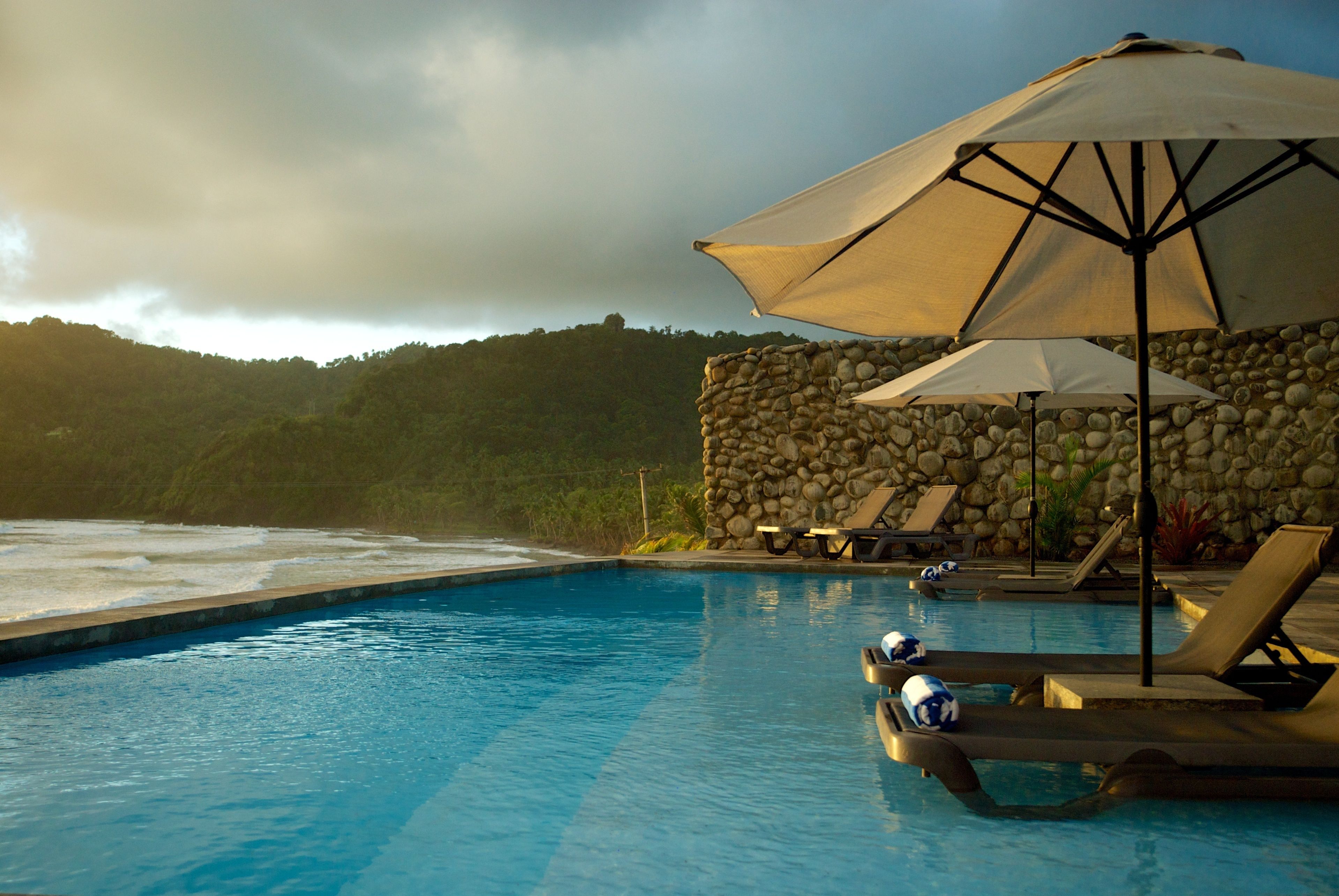 Outdoor pool, pool umbrellas, sun loungers