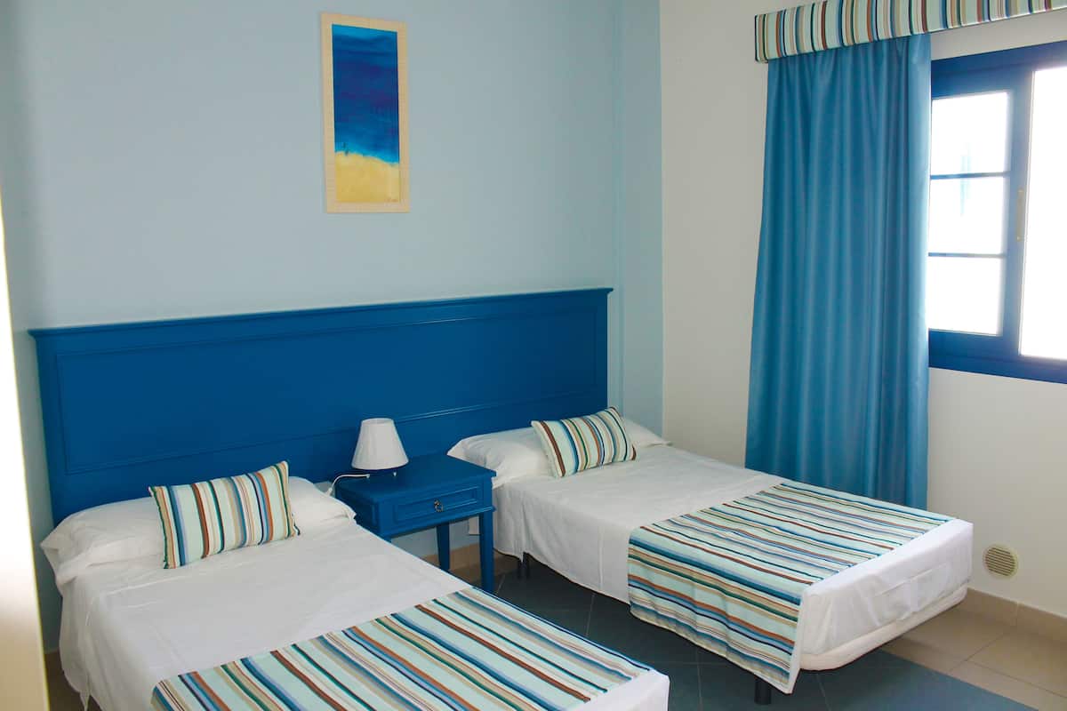 Premium bedding, desk, blackout drapes, iron/ironing board (on request)