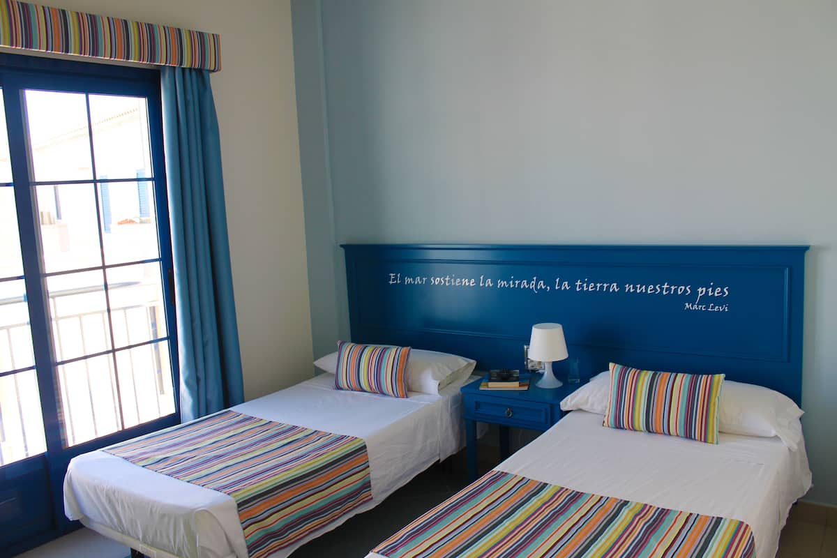 Premium bedding, desk, blackout drapes, iron/ironing board (on request)