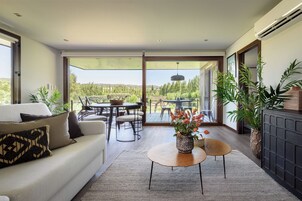 Deluxe Bungalow | Living area | Table tennis, books