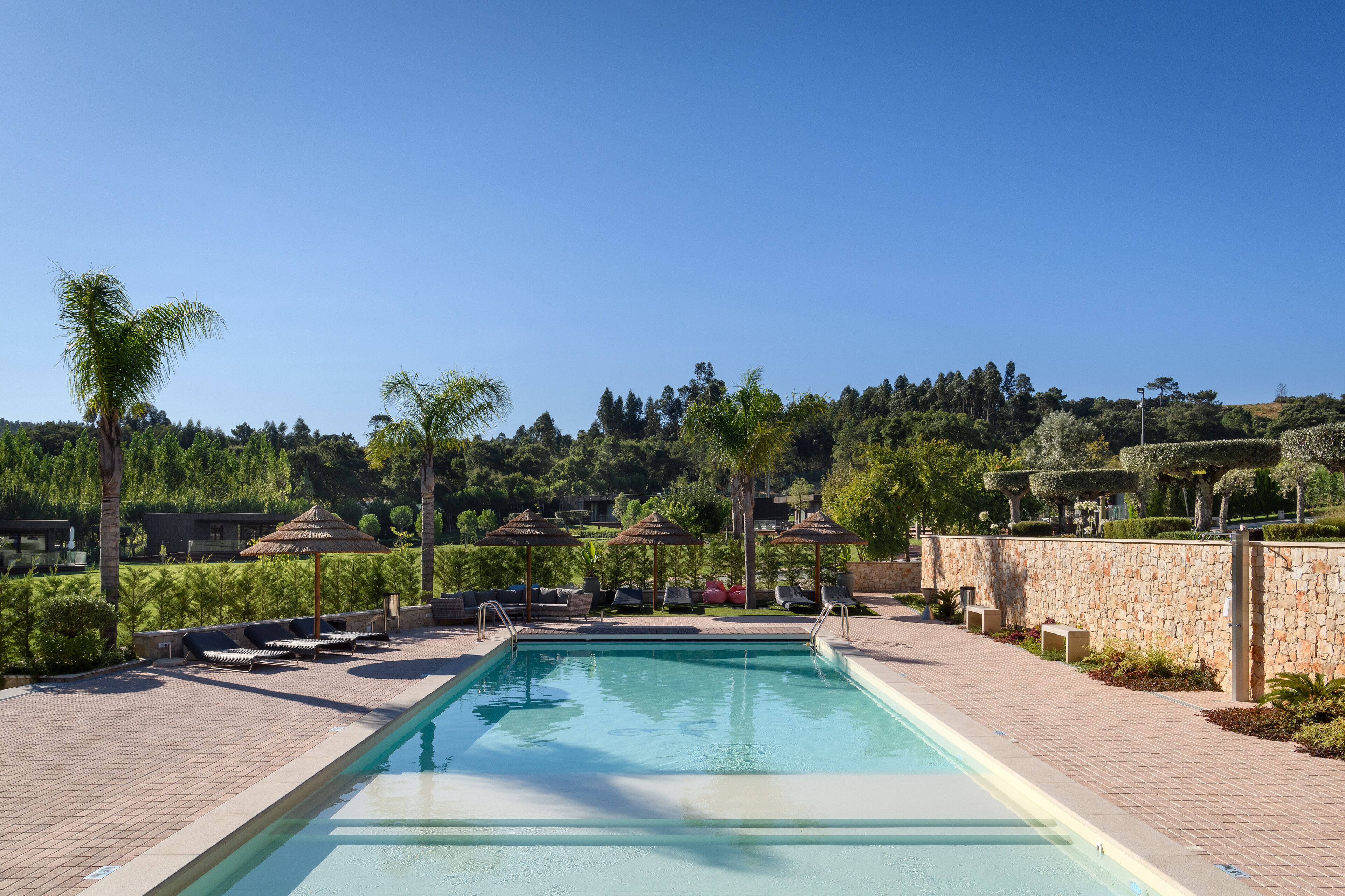 indoor pool, seasonal outdoor pool, open 9:00 am to 8 pm, pool umbrellas