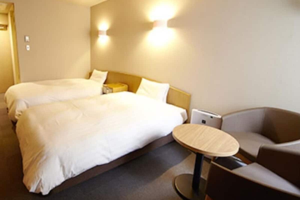 Desk, laptop workspace, free WiFi, bed sheets