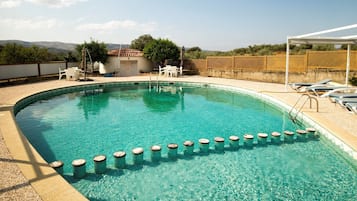 Seasonal outdoor pool, pool loungers