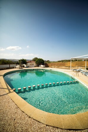 Seasonal outdoor pool, pool loungers