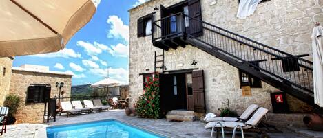 Outdoor pool, pool umbrellas, sun loungers