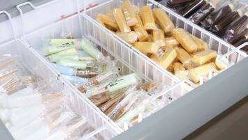 A storage unit with multiple compartments containing various packaged items.