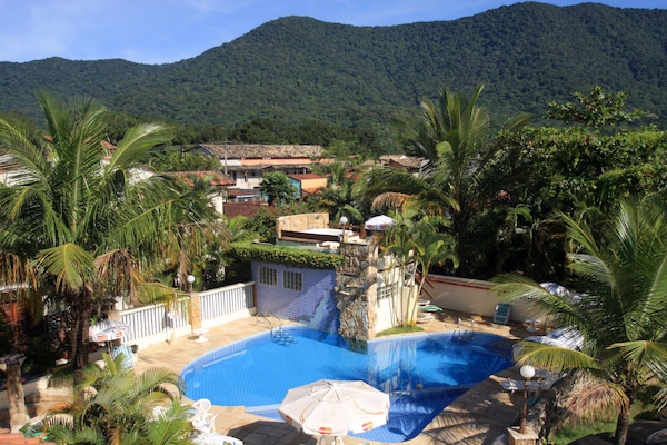 Outdoor pool, open 9:00 AM to 10:30 PM, pool umbrellas, pool loungers