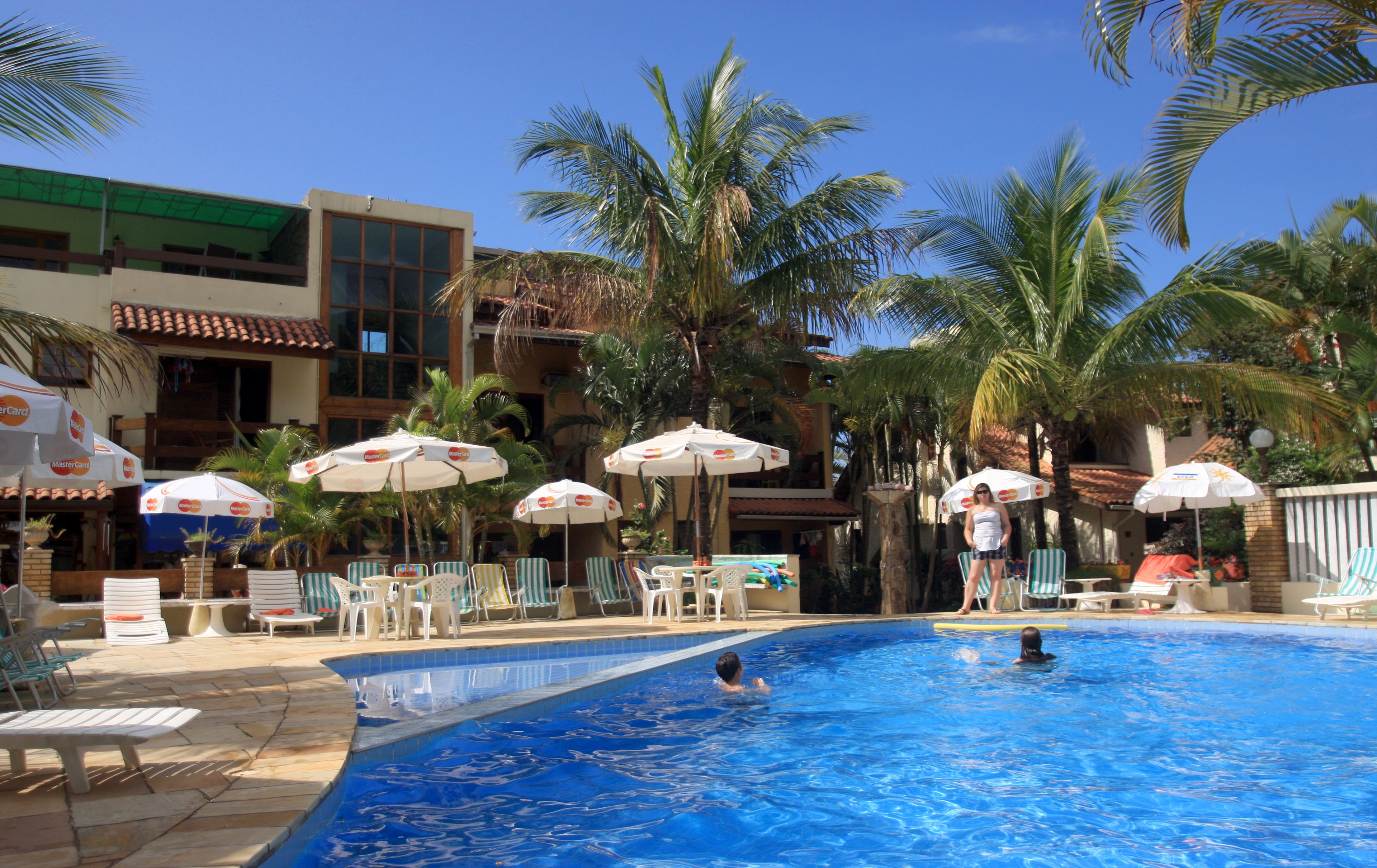 outdoor pool, open 9:00 am to 10:30 pm, pool umbrellas, pool loungers