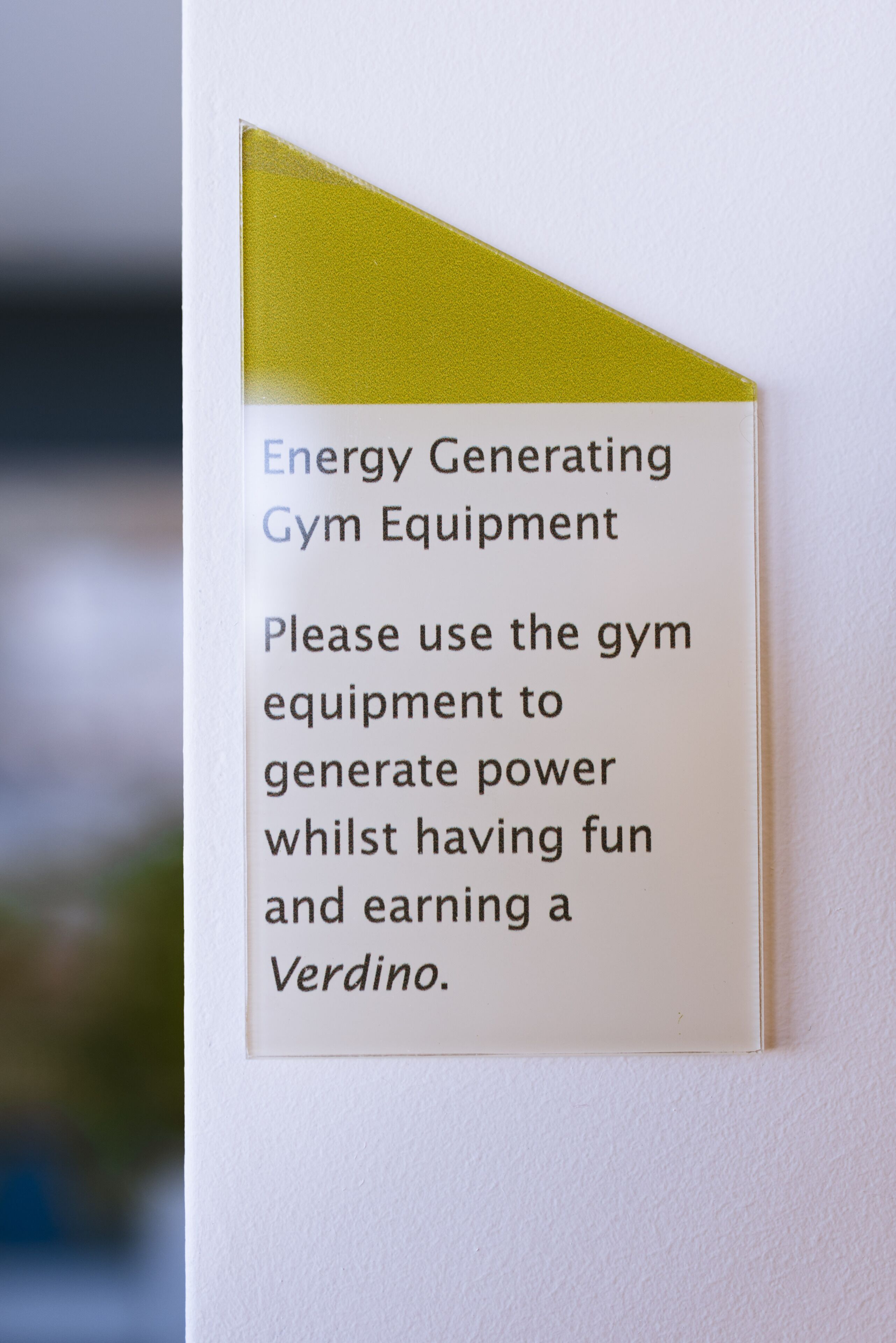 A sign about energy generating gym equipment.