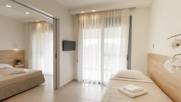 Suite, 2 Bedrooms, Partial Sea View | Minibar, in-room safe, desk, iron/ironing board