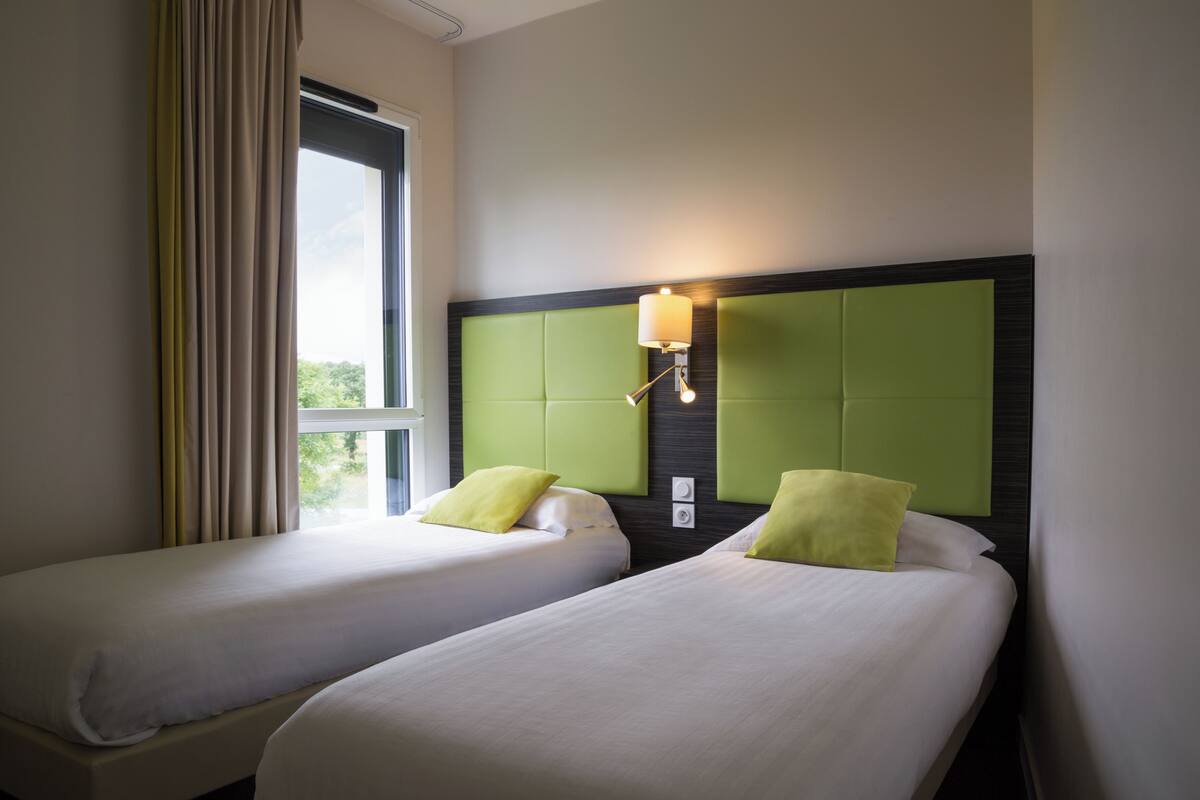 Suite (Quadruple) | 1 bedroom, individually decorated, desk, blackout drapes