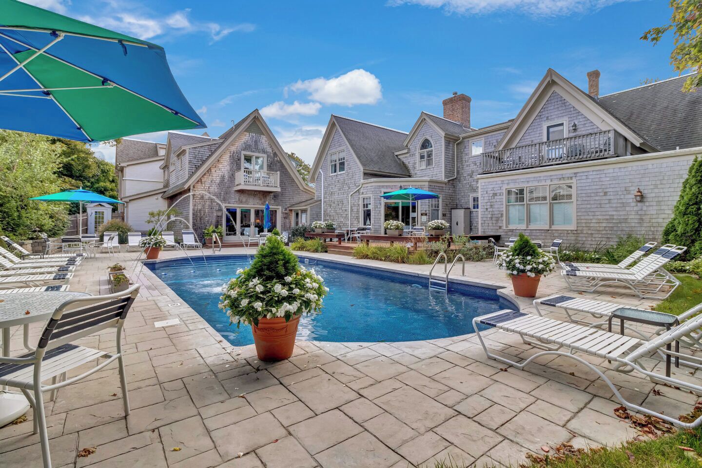 Seasonal outdoor pool, pool umbrellas, pool loungers