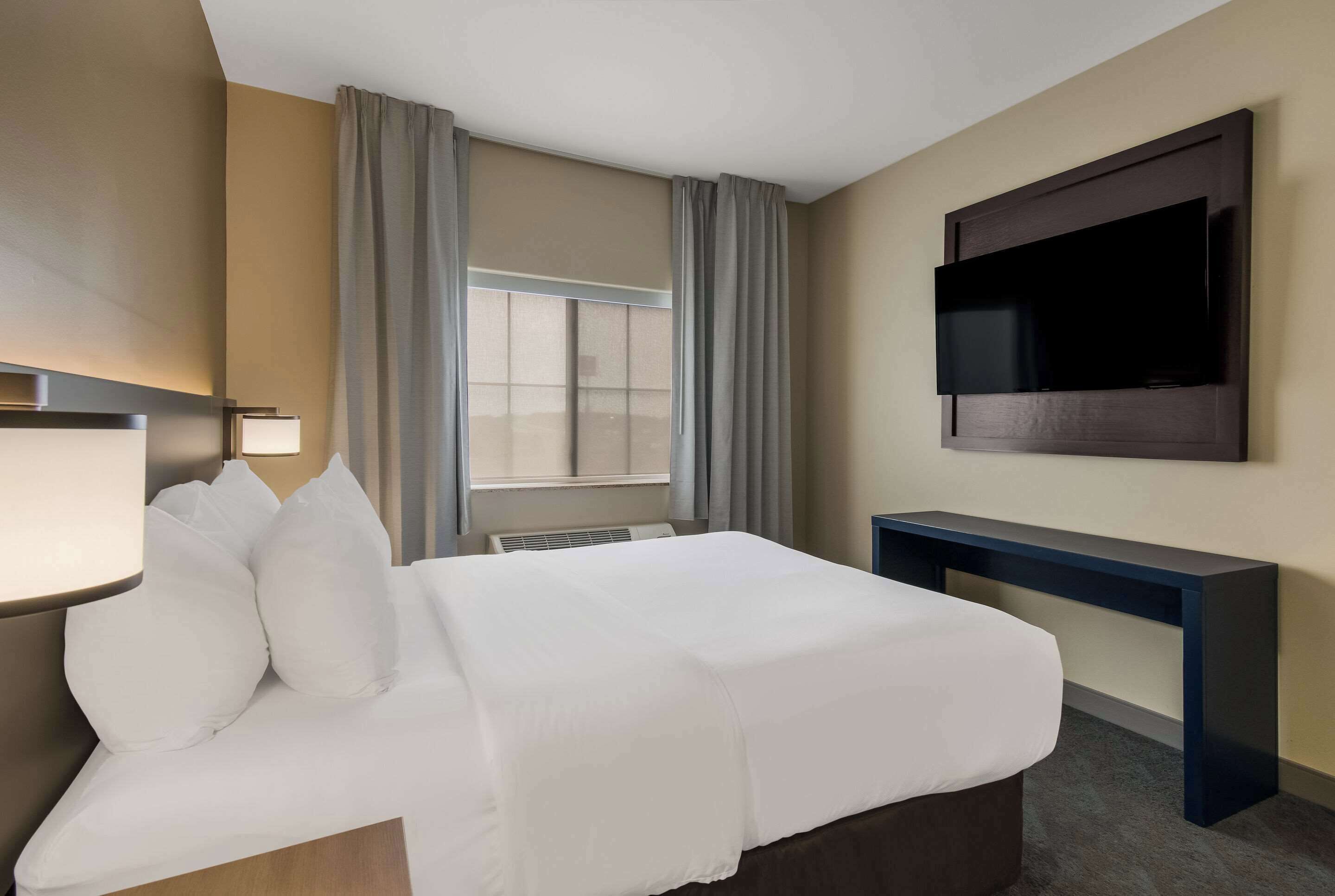 suite, 1 queen bed with sofa bed, non smoking | desk, laptop workspace, blackout curtains, iron/ironing board