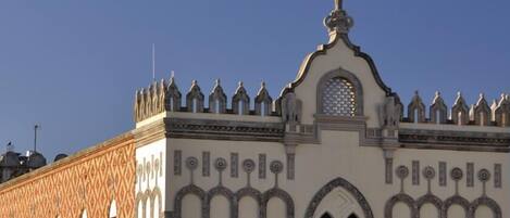 A building with a distinctive architectural style featuring arched windows and a decorative roofline.