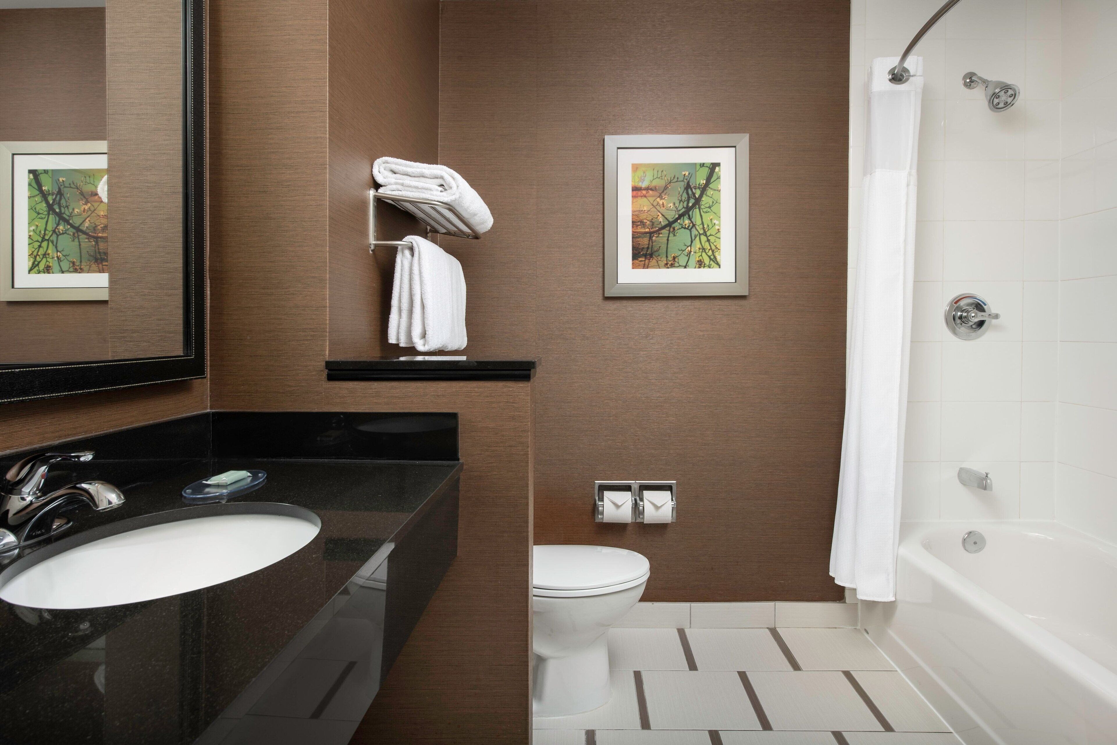 room, 2 queen beds | bathroom | combined shower/bathtub, free toiletries, hair dryer, towels