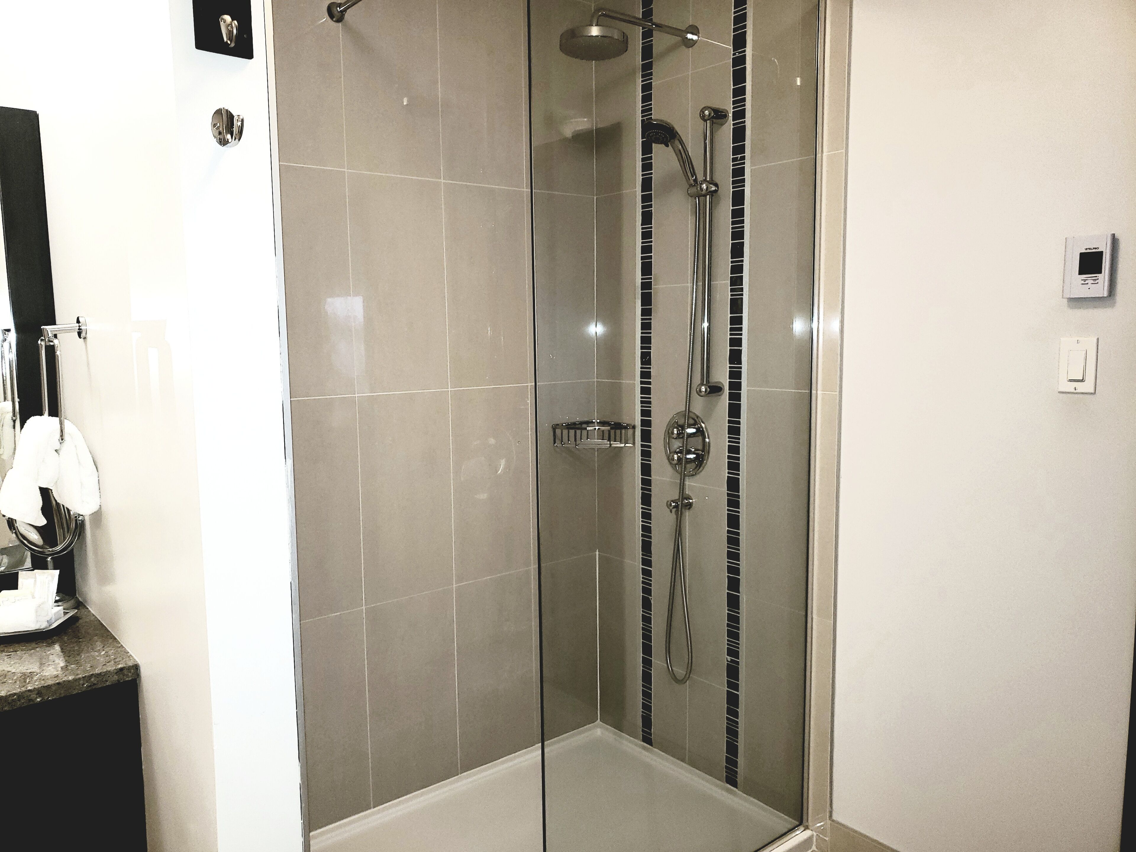 luxury suite, 1 king bed, river view | bathroom shower