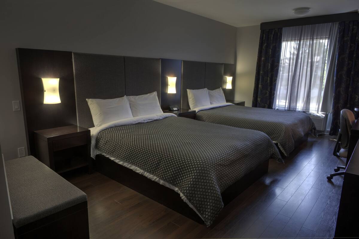 superior double room, 2 queen beds | desk, blackout curtains, iron/ironing board, cots/infant beds