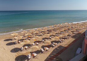 On the beach, sun loungers, beach umbrellas, beach towels