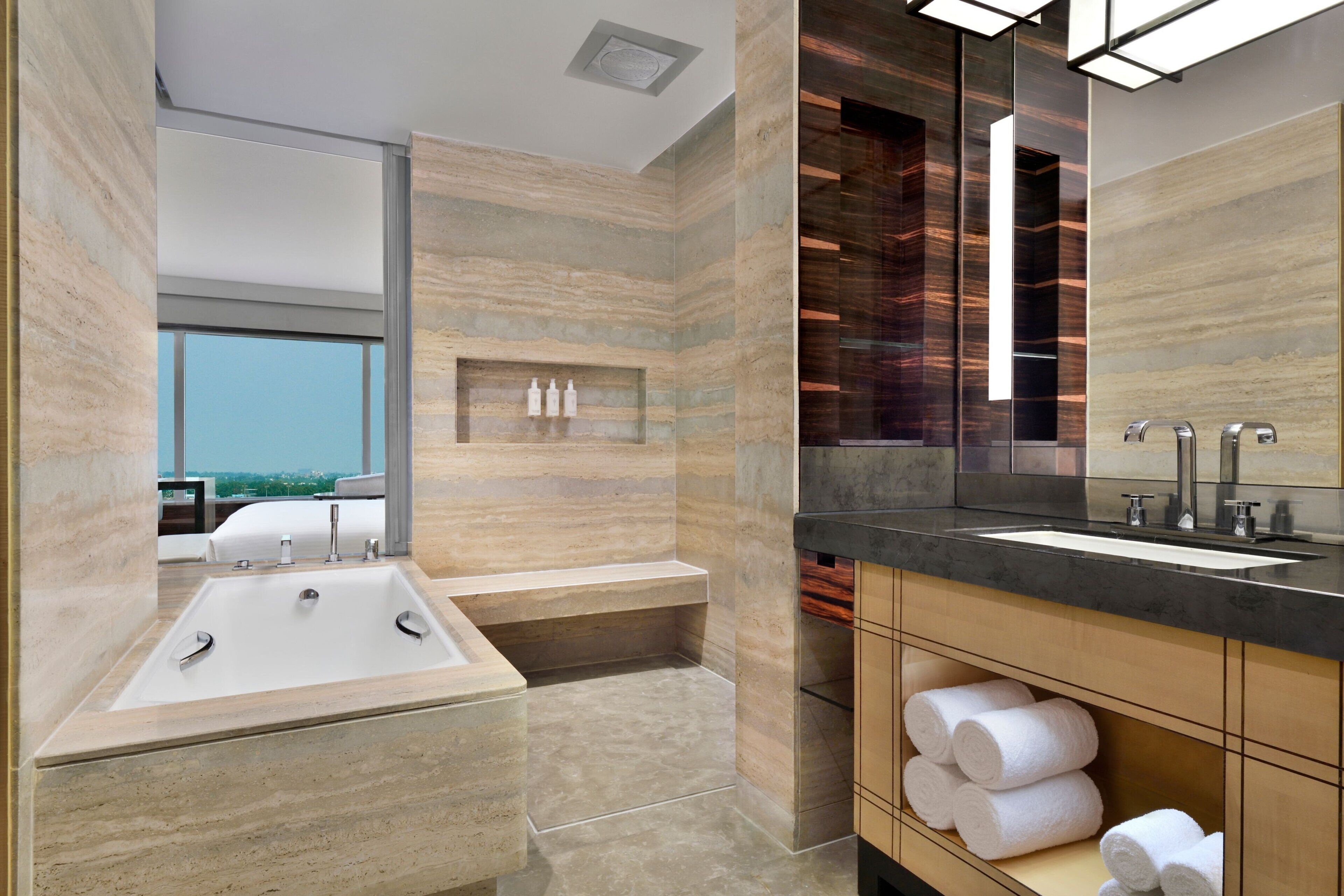 separate bathtub and shower, jetted bath, rainfall showerhead