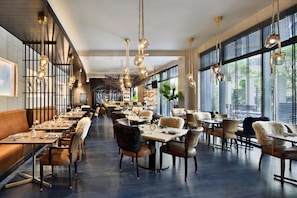 Breakfast, dinner served; international cuisine, al fresco dining