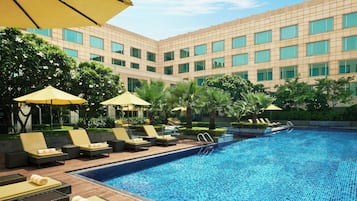 Outdoor pool, open 6:00 AM to 9:00 PM, pool umbrellas