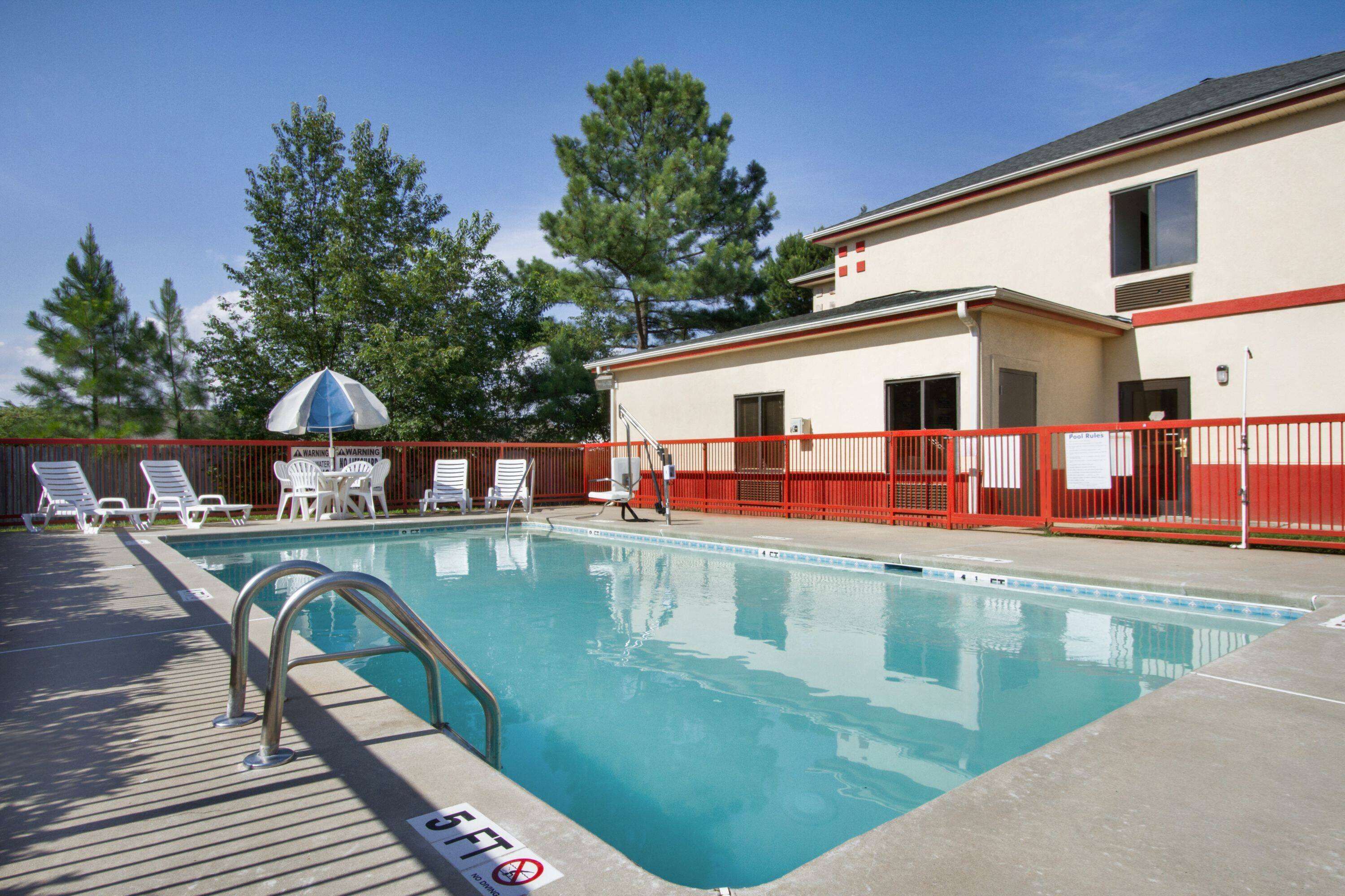 Seasonal outdoor pool, open noon to 8:00 PM, pool umbrellas