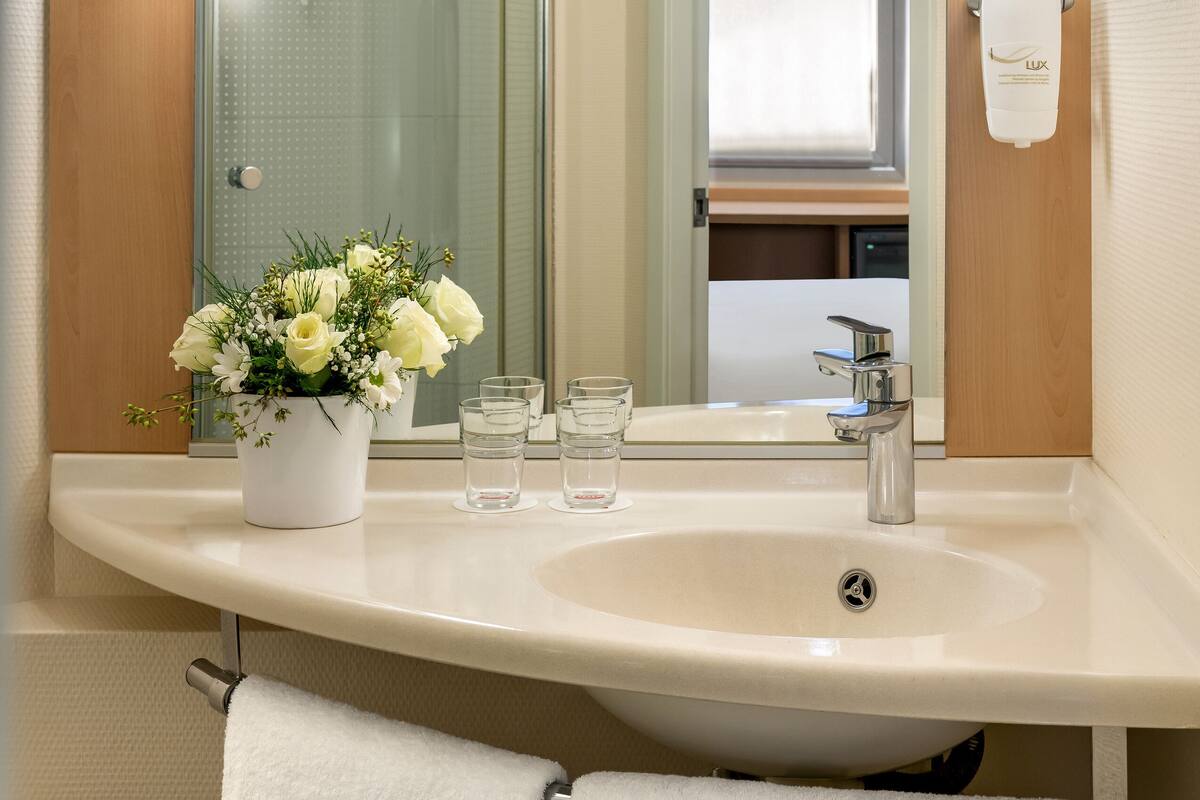 shower, eco-friendly toiletries, hair dryer, slippers