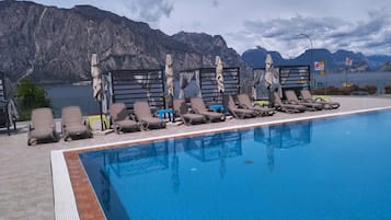 Outdoor pool, open 9:00 AM to 8:00 PM, pool loungers