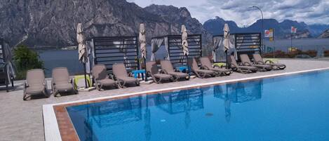 Outdoor pool, open 9:00 AM to 8:00 PM, sun loungers